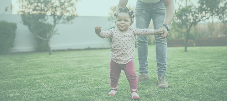 A father and daughter playing in the yard