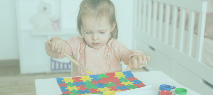 a child playing with puzzle pieces on a table